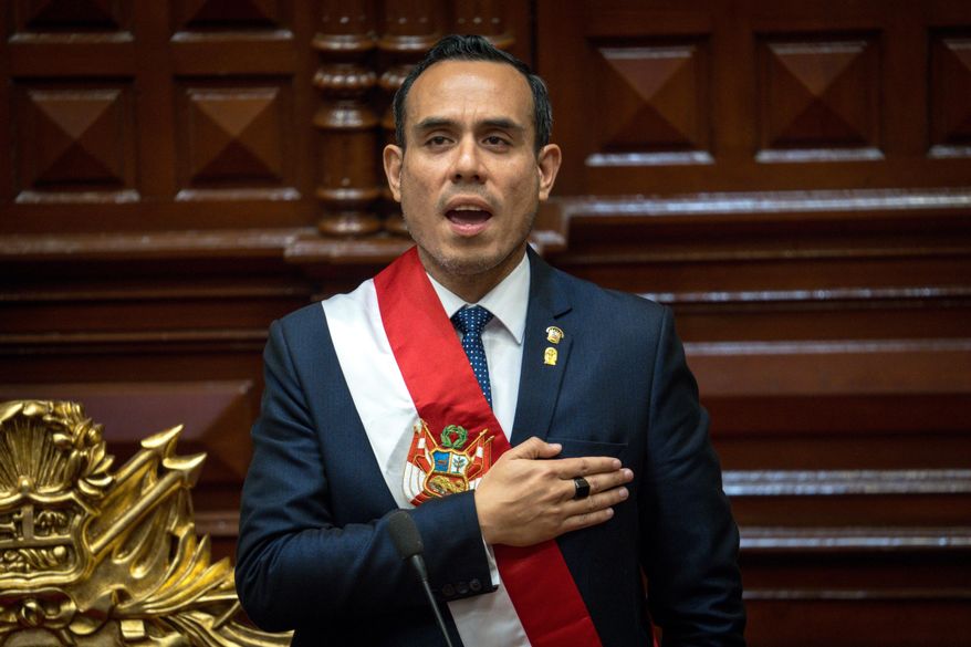 Peru's former president of the Congress Jose Jeri, sings the national anthem after being sworn-in as the interim president in Lima, Peru, Friday, Oct. 10, 2025. (AP Photo/John Reyes)