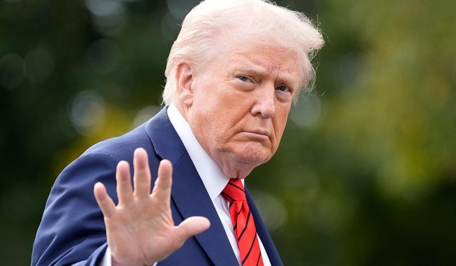 President Donald Trump walks on the South Lawn after arriving on Marine One at the White House, Friday, Oct. 10, 2025, in Washington. (AP Photo/Alex Brandon)