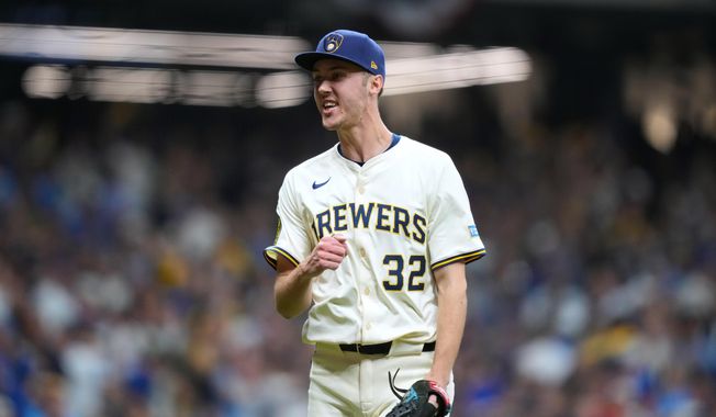 Milwaukee Brewers pitcher Jacob Misiorowski (32) reacts to an out against the Chicago Cubs during the fifth inning of Game 5 of baseball's National League Division Series, Saturday, Oct. 11, 2025, in Milwaukee. (AP Photo/Kayla Wolf)