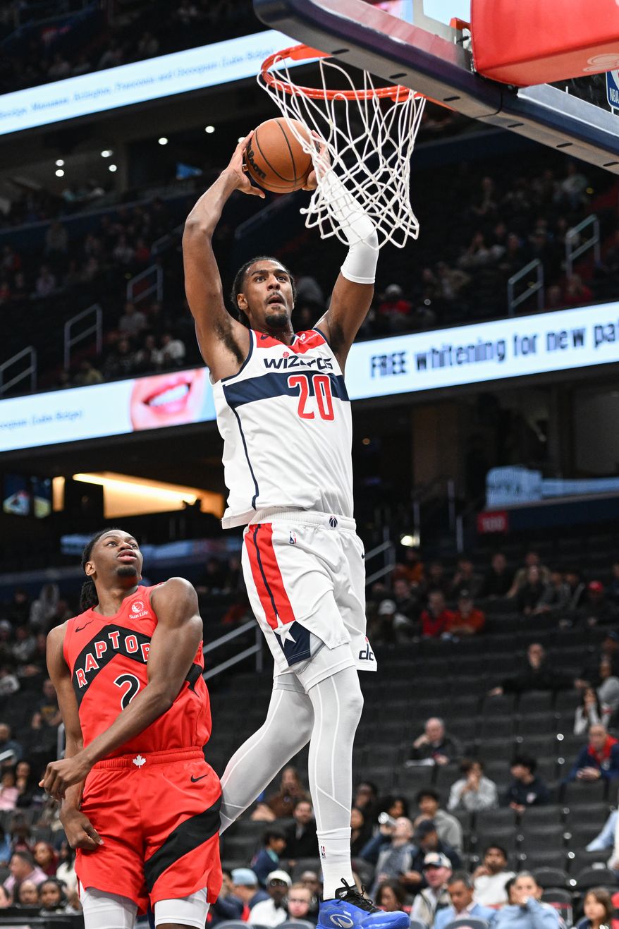 Washington Wizards center Alex Sarr (20) dunking the ball during the first quarter of a preseason NBA game against the Toronto Raptors at Capital One Arena in Washington D.C., October 12, 2025. (Photo for the Washington Times)