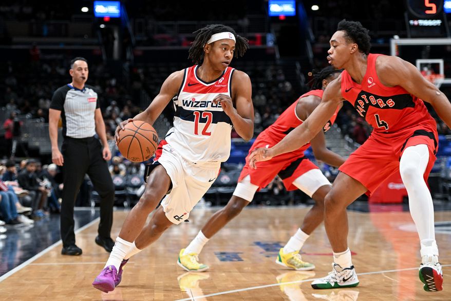 Washington Wizards guard Tre Johnson (12) driving towards the basket during the first quarter of a preseason NBA game against the Toronto Raptors at Capital One Arena in Washington D.C., October 12, 2025. (Photo for the Washington Times)