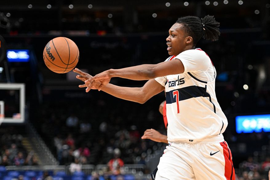 Washington Wizards guard Bub Carrington (7) making a pass during the first quarter of a preseason NBA game against the Toronto Raptors at Capital One Arena in Washington D.C., October 12, 2025. (Photo for the Washington Times)