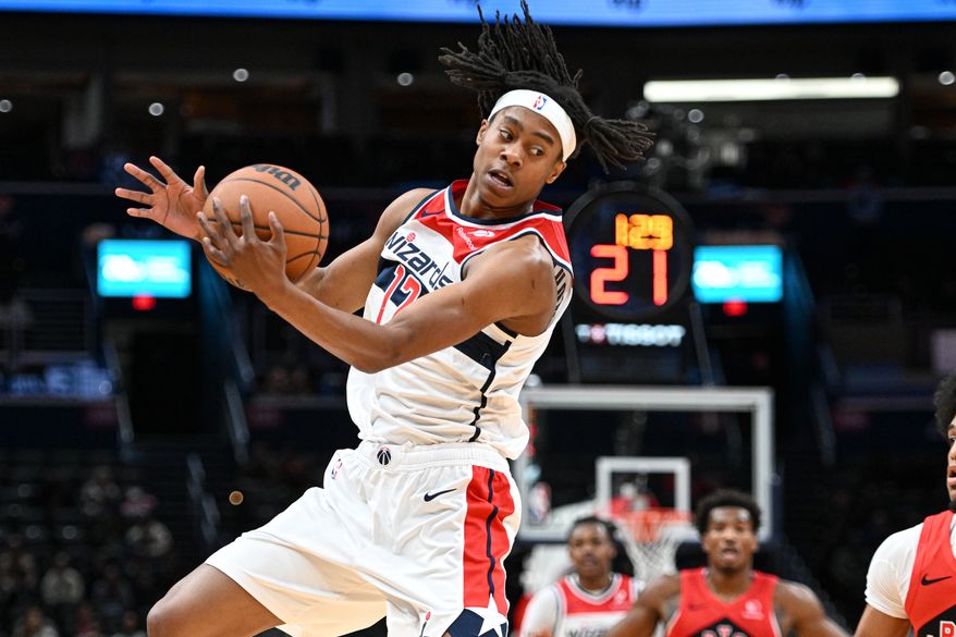 Washington Wizards guard Tre Johnson (12) with the ball during the first quarter of a preseason NBA game against the Toronto Raptors at Capital One Arena in Washington D.C., October 12, 2025. (Photo for the Washington Times)