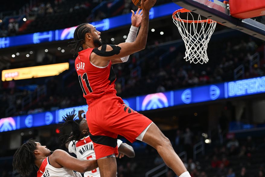 Toronto Raptors center Olivier Sarr (11) putting up the game winning shot during the fourth quarter of a preseason NBA game against the Wasington Wizards at Capital One Arena in Washington D.C., October 12, 2025. (Photo for the Washington Times)