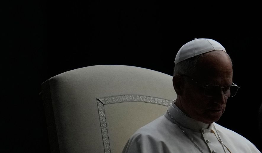 Pope Leo XIV presides over a Rosary vigil for peace in St. Peter's Square on the 63rd anniversary of the start of the Second Vatican Council, at the Vatican, Saturday, Oct. 12, 2025. (AP Photo/Gregorio Borgia)