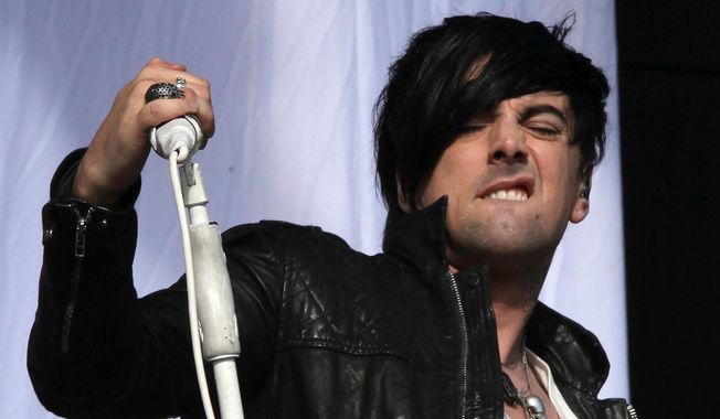 FILE - British musician Ian Watkins, lead singer of Lostprophets, as he performs on stage at V Music Festival in Hylands Park, Chelmsford, England on Aug 20, 2011. (AP Photo/Joel Ryan, File)