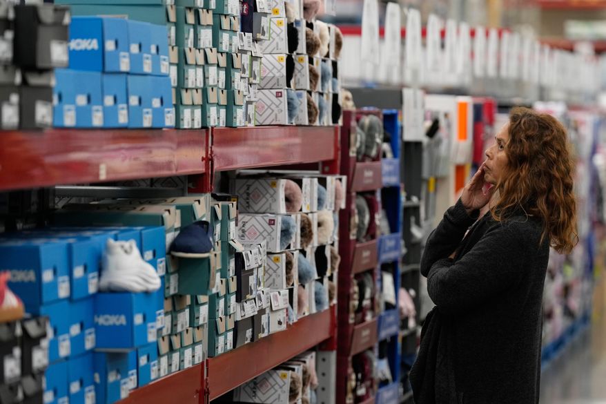 A woman looks at shoes at a Sam's Club, Wednesday, Sept. 24, 2025, in Bentonville, Ark. (AP Photo/Charlie Riedel) ** FILE **