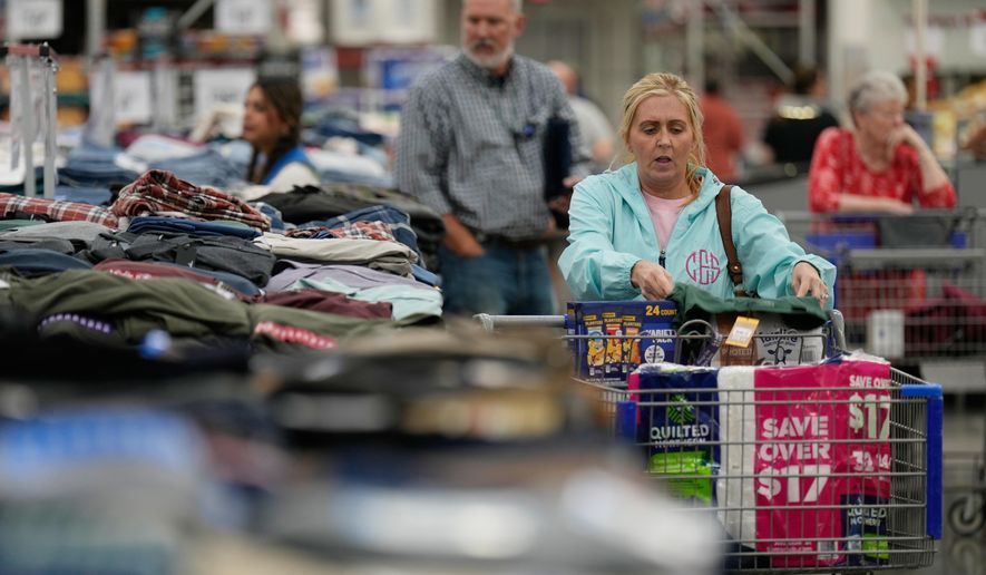 People shop for clothing at a Sam's Club, Wednesday, Sept. 24, 2025, in Bentonville, Ark. (AP Photo/Charlie Riedel)