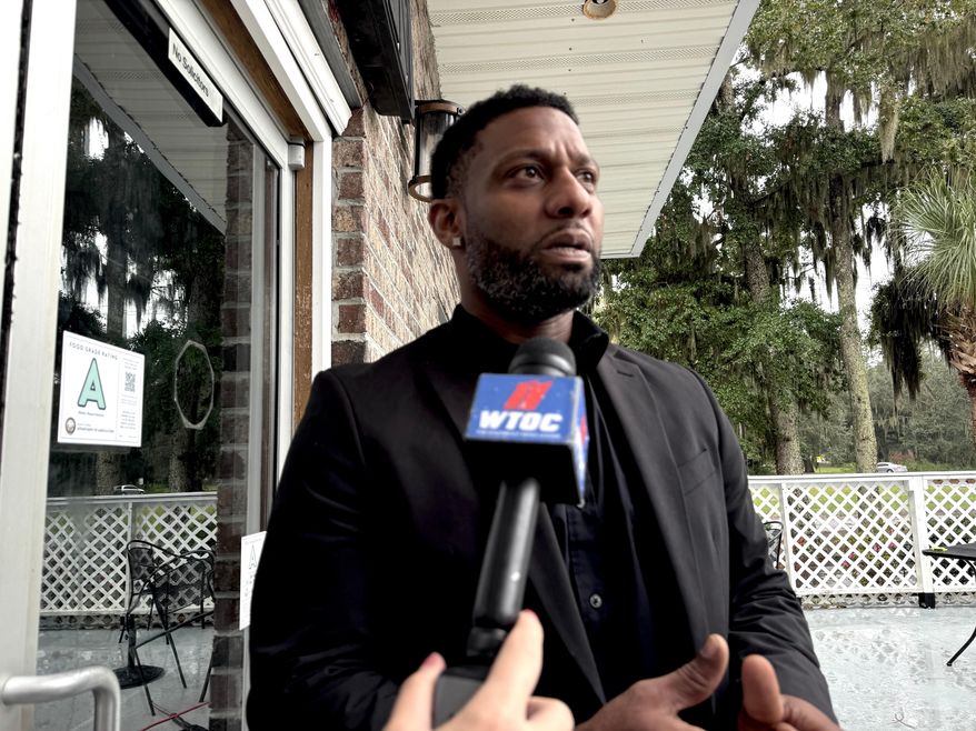 Owner Willie Turral talks to the media outside of Willie's Bar and Grill in St. Helena Island, S.C., after a shooting occurred early Sunday, Oct. 12, 2025. (AP Photo/Lewis M. Levine)