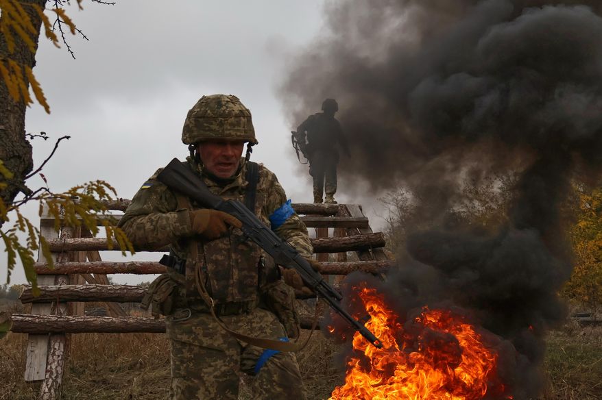 In this photo provided by Ukraine's 65th Mechanized Brigade press service, recruits attend drills at a training ground in the Zaporizhzhia region, Ukraine, Saturday, Oct. 11, 2025. (Andriy Andriyenko/Ukraine's 65th Mechanized Brigade via AP)