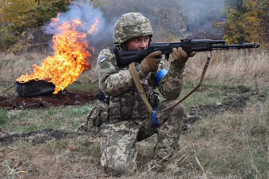 In this photo provided by Ukraine's 65th Mechanized Brigade press service, recruits attend drills at a training ground in the Zaporizhzhia region, Ukraine, Saturday, Oct. 11, 2025. (Andriy Andriyenko/Ukraine's 65th Mechanized Brigade via AP)