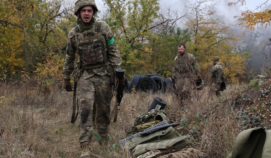 In this photo provided by Ukraine's 65th Mechanized Brigade press service, recruits attend drills at a training ground in the Zaporizhzhia region, Ukraine, Saturday, Oct. 11, 2025. (Andriy Andriyenko/Ukraine's 65th Mechanized Brigade via AP)
