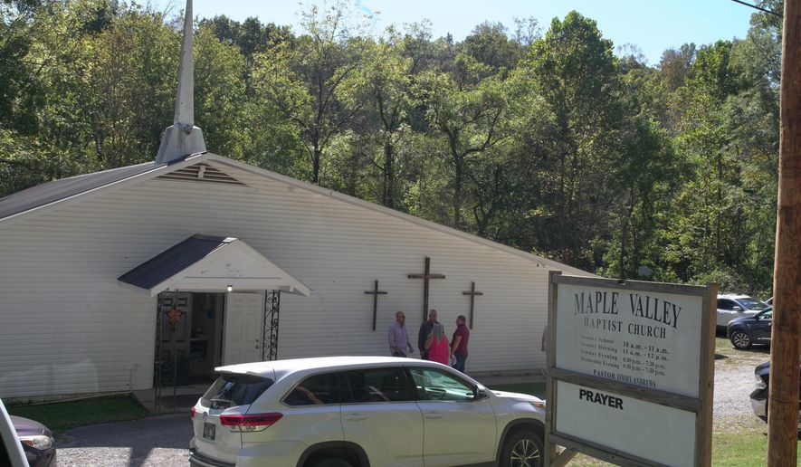 Congregants stand outside Maple Valley Baptist Church in McEwen, Tenn., Sunday, Oct. 12, 2025, about 3 miles from Accurate Energetic Systems, an explosives plant where a blast Friday killed 16 people. (AP Photo/Obed Lamy)