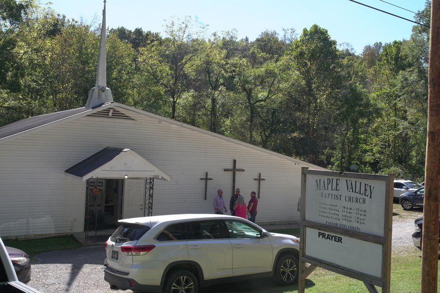 Congregants stand outside Maple Valley Baptist Church in McEwen, Tenn., Sunday, Oct. 12, 2025, about 3 miles from Accurate Energetic Systems, an explosives plant where a blast Friday killed 16 people. (AP Photo/Obed Lamy)