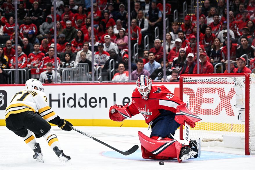 Washington Capitals goalie Logan Thompson (48) blocks a breakaway attempt by Boston Bruins left wing Viktor Arvidsson (71) against the Boston Bruins at Capital One Arena, Washington, D.C., October 8, 2025. (Photo by Brian Murphy for the Washington Times)