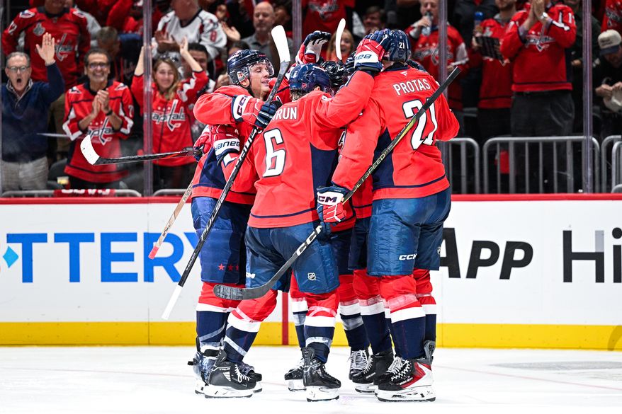 Washington Capitals forward Tom Wilson (43) celebrates with teammates after scoring his first goal of the season against the Boston Bruins at Capital One Arena, Washington, D.C., October 8, 2025. (Photo by Brian Murphy for the Washington Times)