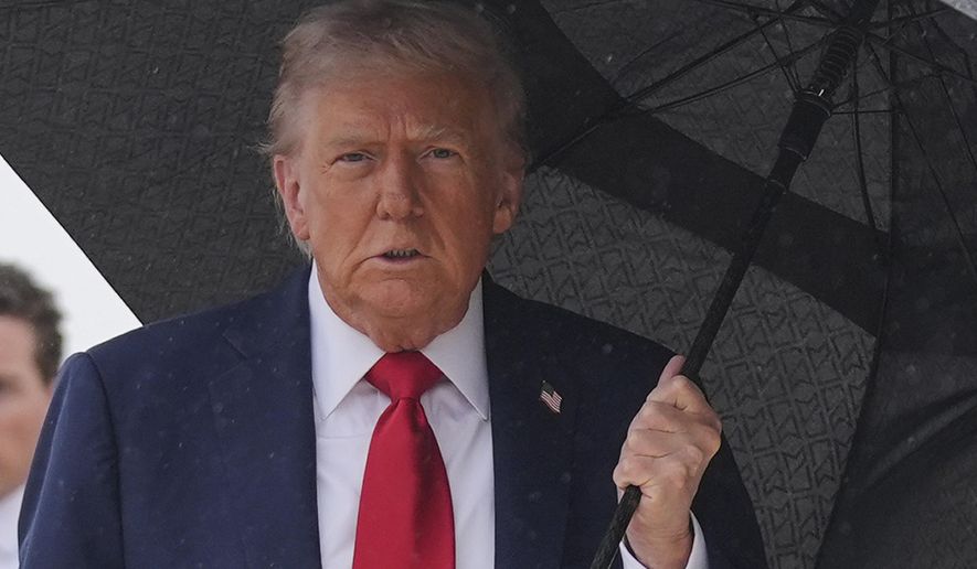 President Donald Trump walks over to speak with reporters before boarding Air Force One, Sunday, Oct. 12, 2025, at Joint Base Andrews, Md., as he heads to the Middle East. (AP Photo/Evan Vucci)