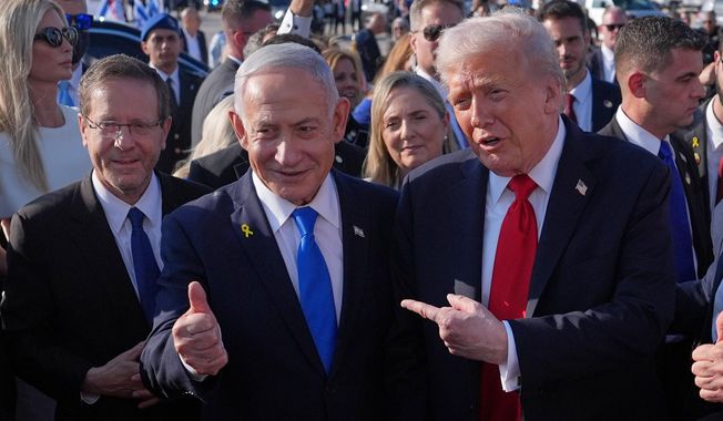 President Donald Trump poses for a photo with Israel's Prime Minister Benjamin Netanyahu before he boards Air Force One at Ben Gurion International Airport, Monday, Oct. 13, 2025, near Tel Aviv, as Israel's President Isaac Herzog watches at left. (AP Photo/Evan Vucci)