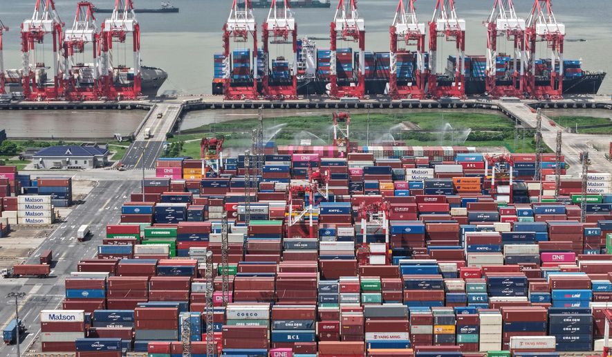 An aerial view of a container terminal in Shanghai, China Monday, Oct. 13, 2025. (Chinatopix via AP)