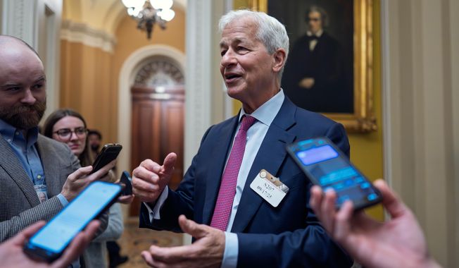 Jamie Dimon, CEO and chairman of JPMorgan Chase, pauses to talk to reporters after lunch with Republican senators to discuss the economy, at the Capitol in Washington, Wednesday, Sept. 17, 2025. (AP Photo/J. Scott Applewhite)