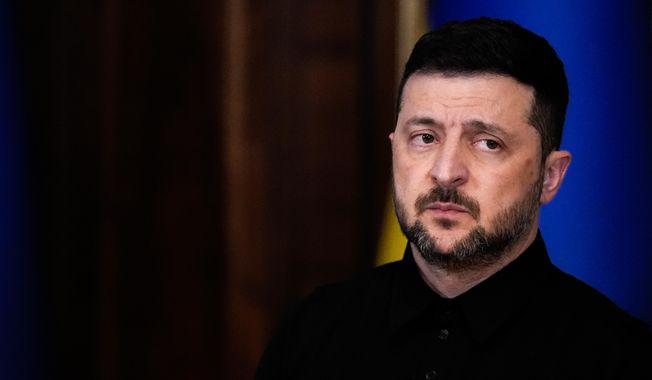 Ukraine's President Volodymyr Zelenskyy listens as High Representative of the European Union for Foreign Affairs and Security Policy Kaja Kallas speaks during a news conference, Monday, Oct. 13, 2025, in Kyiv, Ukraine. (AP Photo/Julia Demaree Nikhinson)