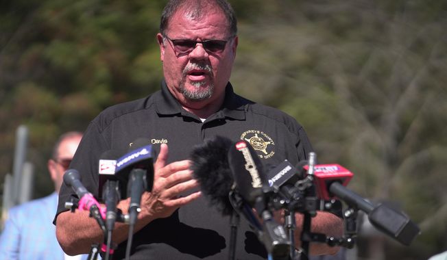 Humphreys County Sheriff Chris Davis, right, speaks during a news conference Monday, Oct. 13, 2025, in McEwen, Tenn., at Accurate Energetic Systems. (AP Photo/Obed Lamy)