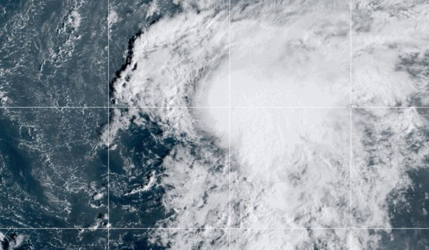 This satellite image provided by the National Oceanic and Atmospheric Administration (NOAA) shows Tropical Storm Lorenzo in the Atlantic Ocean, Monday, Oct. 13, 2025. (NOAA via AP)