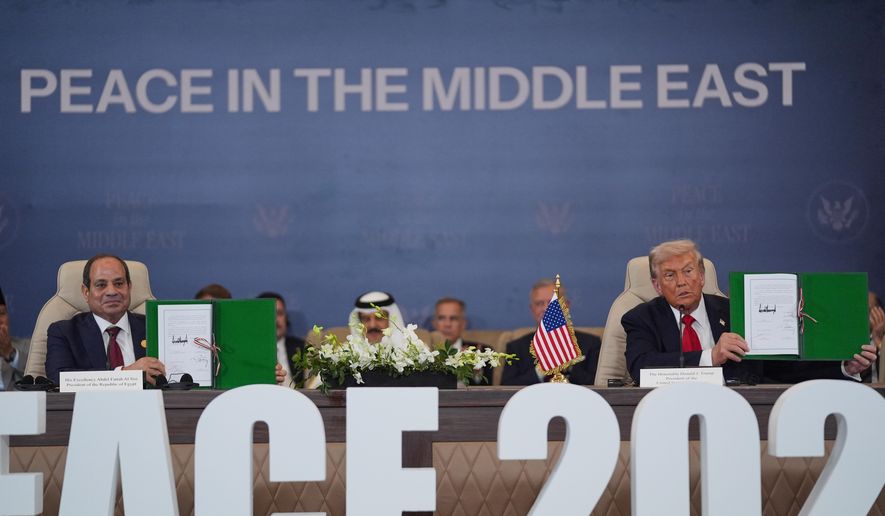 President Donald Trump and Egypt's President Abdel-Fattah el-Sissi hold signed documents during a summit to support ending the more than two-year Israel-Hamas war in Gaza after a breakthrough ceasefire deal, Monday, Oct. 13, 2025, in Sharm El Sheikh, Egypt. (AP Photo/Evan Vucci)