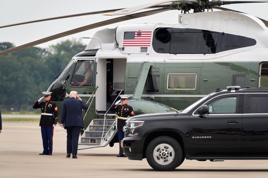 President Donald Trump boards Marine One after speaking to a gathering of top U.S. military commanders at Marine Corps Base Quantico, Tuesday, Sept. 30, 2025, in Quantico, Va. (AP Photo/Evan Vucci)