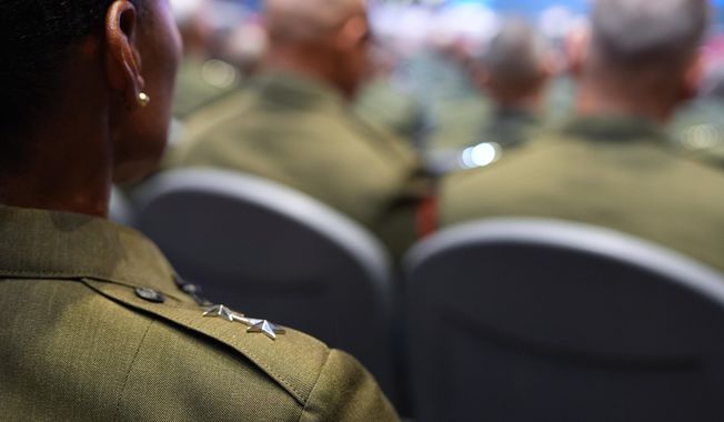 U.S. military senior leadership listen as President Donald Trump speaks at Marine Corps Base Quantico, Tuesday, Sept. 30, 2025 in Quantico, Va. (AP Photo/Evan Vucci)