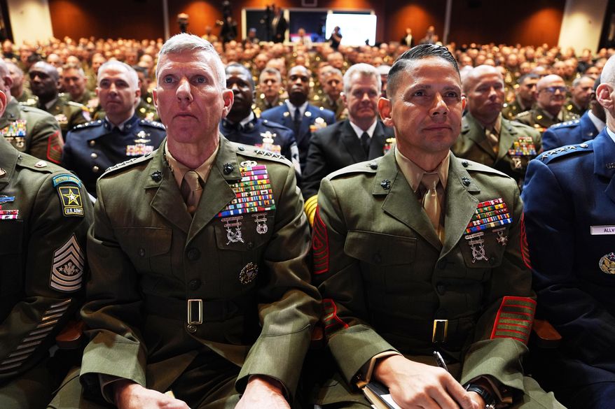U.S. military senior leadership listen as President Donald Trump speaks at Marine Corps Base Quantico, Tuesday, Sept. 30, 2025 in Quantico, Va. (AP Photo/Evan Vucci)