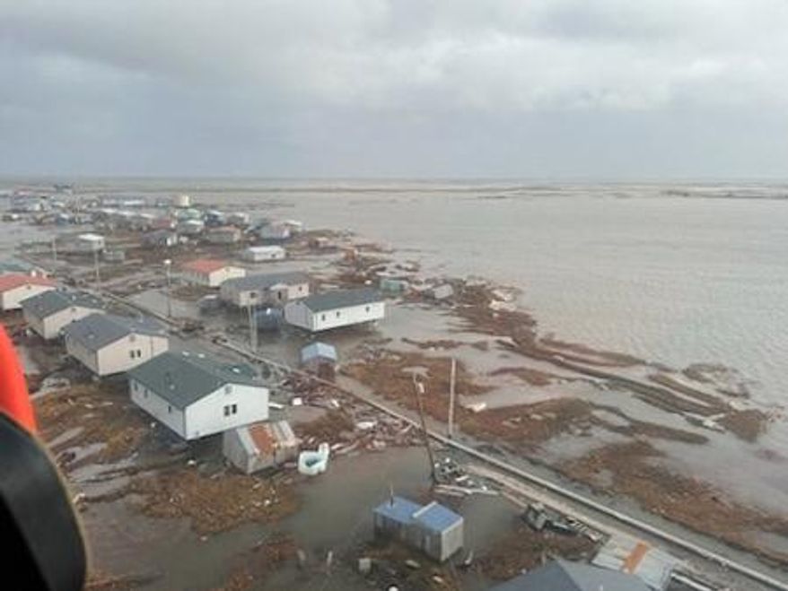 In this photo provided by the U.S. Coast Guard, Kipnuk, Alaska, experiences coastal flooding, Sunday, Oct. 12, 2025. (U.S. Coast Guard via AP)