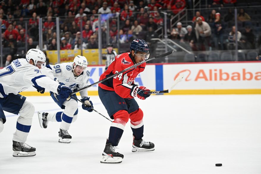 Washington Capitals forward Justin Sourdif (34) skating with the puck on as breakaway during the first period of an NHL game against the Tampa Bay Lightning at Capital One Arena in Washington D.C., October 14, 2025. (Photo for the Washington Times)