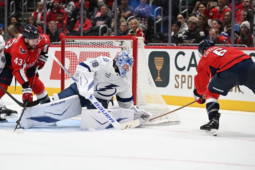 Tampa Bay Lightning goalie Andrei Vasilevskiy (88) defends against a wrap around attempt by Washington Capitals defenseman Jakob Chychrun (6) during the first period of an NHL game at Capital One Arena in Washington D.C., October 14, 2025. (Photo for the Washington Times)