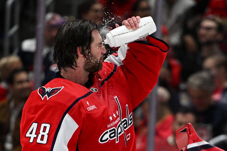 Washington Capitals goalie Logan Thompson (48) spashing water on his face during a break in the action during the second period of an NHL game against the Tampa Bay Lightning at Capital One Arena in Washington D.C., October 14, 2025. (Photo for the Washington Times)