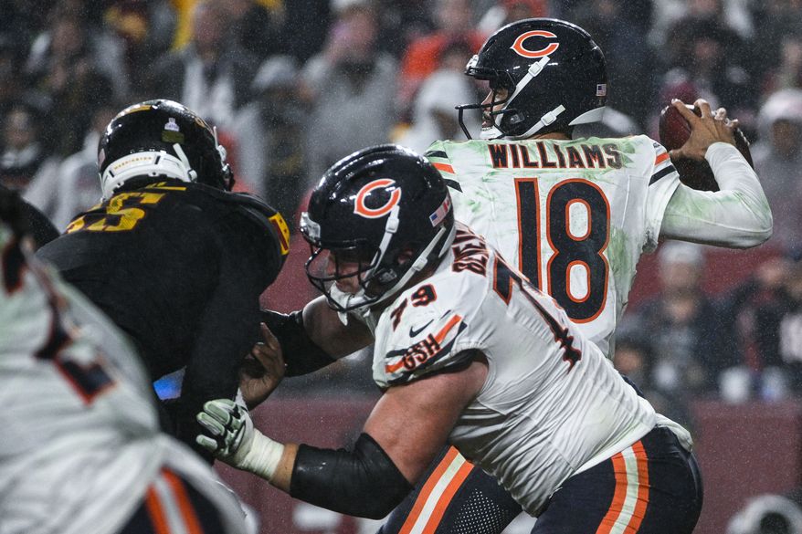 Chicago Bears quarterback Caleb Williams (18) steps up in the pocket as Washington Commanders defensive end Jacob Martin (55) pressures him during the fourth quarter at Northwest Stadium in Landover, Maryland, October 13, 2025. (Photo by Brian Murphy for the Washington Times)