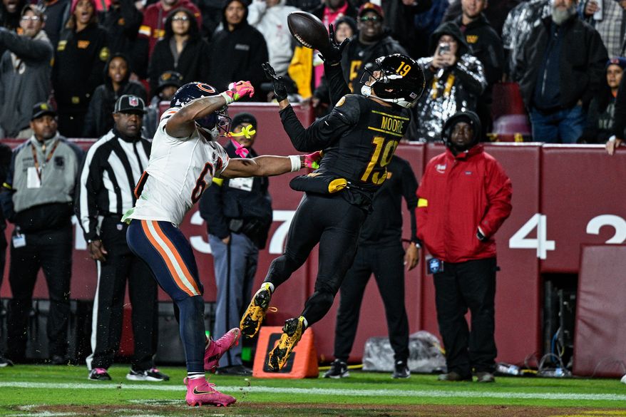 Washington Commanders receiver Chris Moore (19) secures a 22-yard touchdown reception in the corner of the end zone against the Chicago Bears at Northwest Stadium in Landover, Maryland, October 13, 2025. (Photo by Brian Murphy for the Washington Times)
