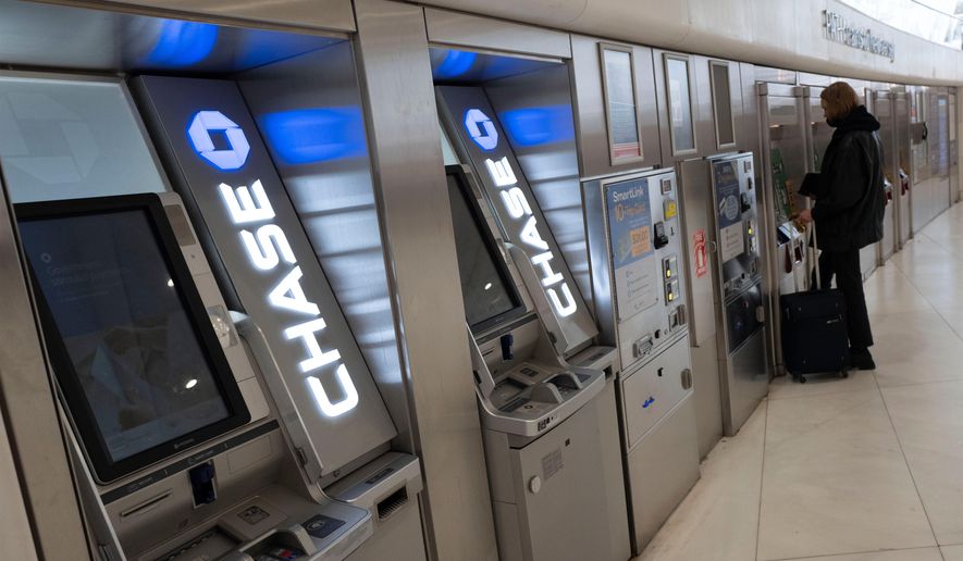 FILE - Chase Bank ATMs are shown, Thursday, March 25, 2021, in New York. (AP Photo/Mark Lennihan, File)