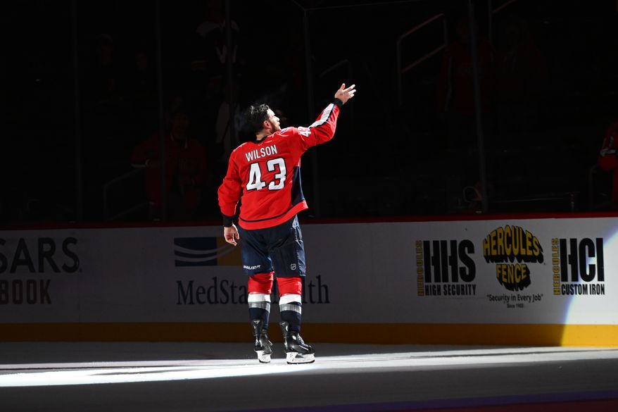 Washington Capitals right wing Tom Wilson (43) throwing a puck into the crowd after being named number one star of the game after the team’s 3-2 overtime victory over the Tampa Bay Lightning at Capital One Arena in Washington D.C., October 14, 2025. (Photo for the Washington Times)