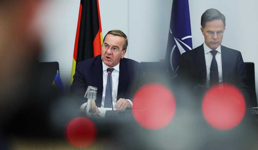Germany's Defense Minister Boris Pistorius, left, addresses a meeting of the Ukraine Defense Contact Group at NATO headquarters in Brussels, Wednesday, Oct. 15, 2025 (AP Photo/Omar Havana)