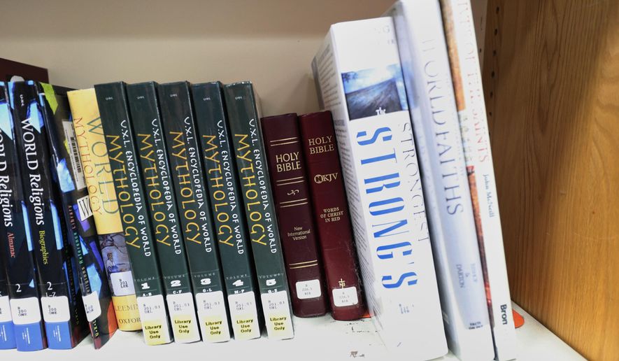 Copies of the Bible are displayed Aug. 12, 2024, at the Bixby High School library in Bixby, Okla. (AP Photo/Joey Johnson, File)