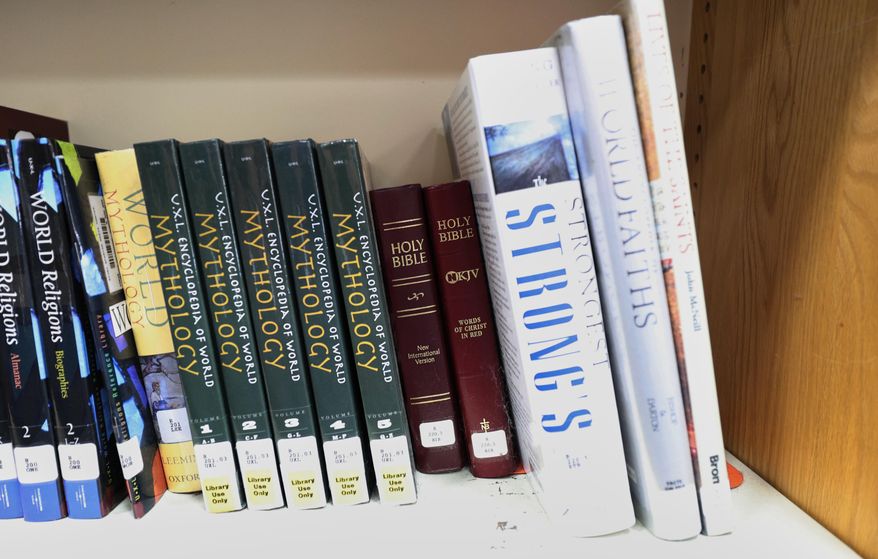Copies of the Bible are displayed Aug. 12, 2024, at the Bixby High School library in Bixby, Okla. (AP Photo/Joey Johnson, File)