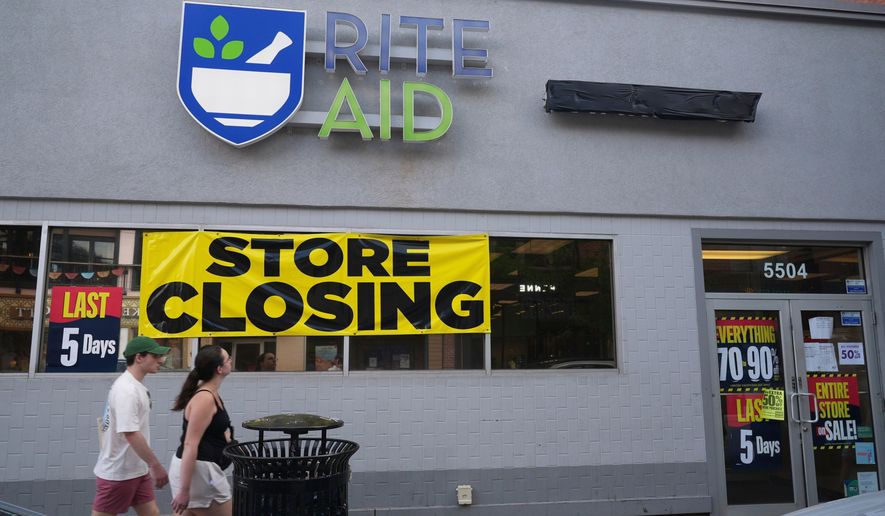 FILE - A store closing banner hangs on a Rite Aid store in Pittsburgh on June 25, 2025. (AP Photo/Gene J. Puskar, File)