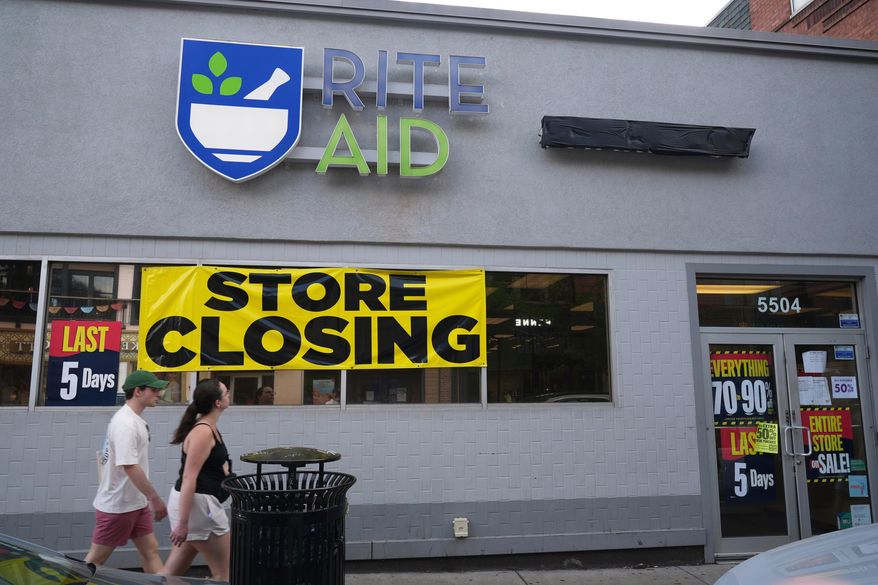 FILE - A store closing banner hangs on a Rite Aid store in Pittsburgh on June 25, 2025. (AP Photo/Gene J. Puskar, File)