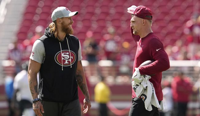 San Francisco 49ers tight end George Kittle, left, and Arizona Cardinals tight end Trey McBride chat prior to an NFL football game Sunday, Sept. 21, 2025, in Santa Clara. (AP Photo/Godofredo A. Vásquez)
