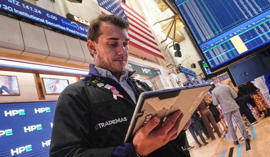 Trader Dylan Halvorsan works on the floor of the New York Stock Exchange, Wednesday, Oct. 15, 2025. (AP Photo/Richard Drew)