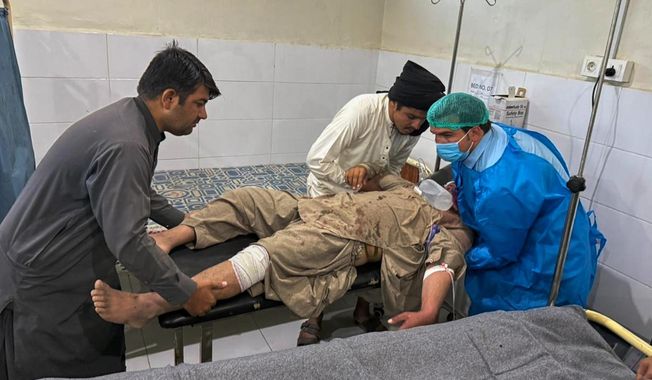 A man, who was injured in the clashes between Pakistan and Afghan forces in border area, receives medical treatment at a hospital in Chaman, a town on the Pakistan side of the Afghanistan border, Wednesday, Oct. 15, 2025. (AP Photo/H. Achakzai)