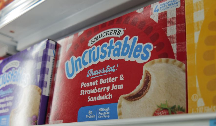 A box of Smucker's Uncrustables sandwiches are seen in a freezer of a supermarket in New York on Wednesday, Oct. 15, 2025. (AP Photo/Patrick Sison)