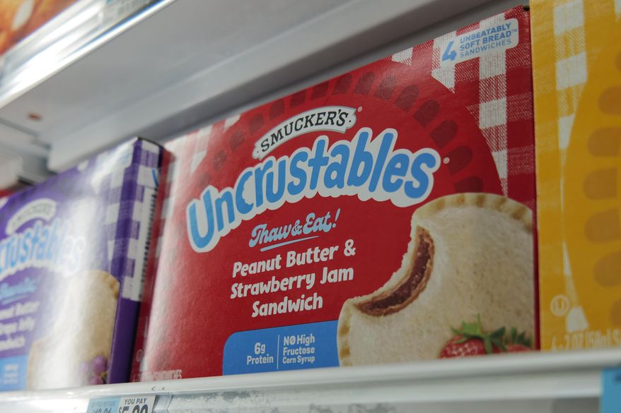 A box of Smucker's Uncrustables sandwiches are seen in a freezer of a supermarket in New York on Wednesday, Oct. 15, 2025. (AP Photo/Patrick Sison)