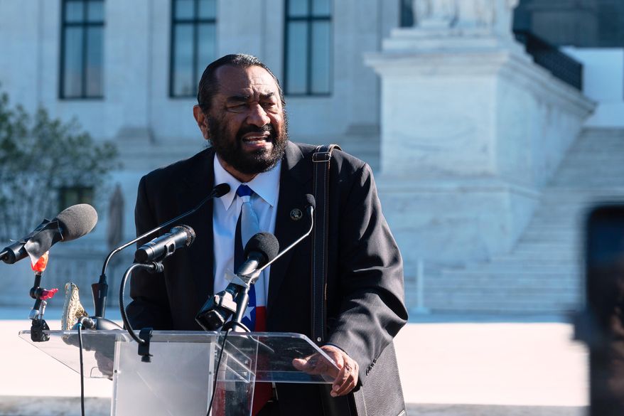 Rep. Al Green, D-Texas, speaks to voting rights activists outside the Supreme Court in Washington, early Wednesday, Oct. 15, 2025, as the justices prepare to take up a major Republican-led challenge to the Voting Rights Act, the centerpiece legislation of the Civil Rights Movement. (AP Photo/Cliff Owen)